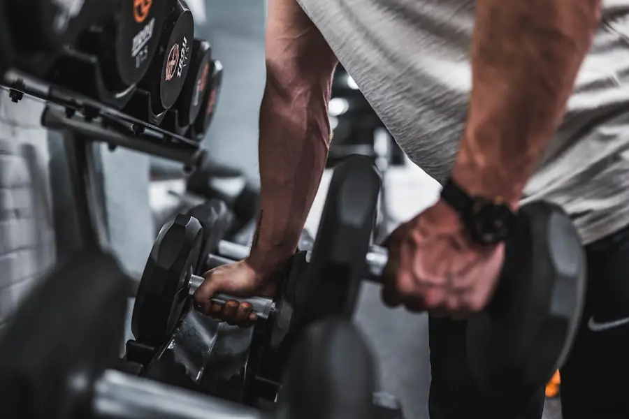 Hands lifting dumbbells from a rack