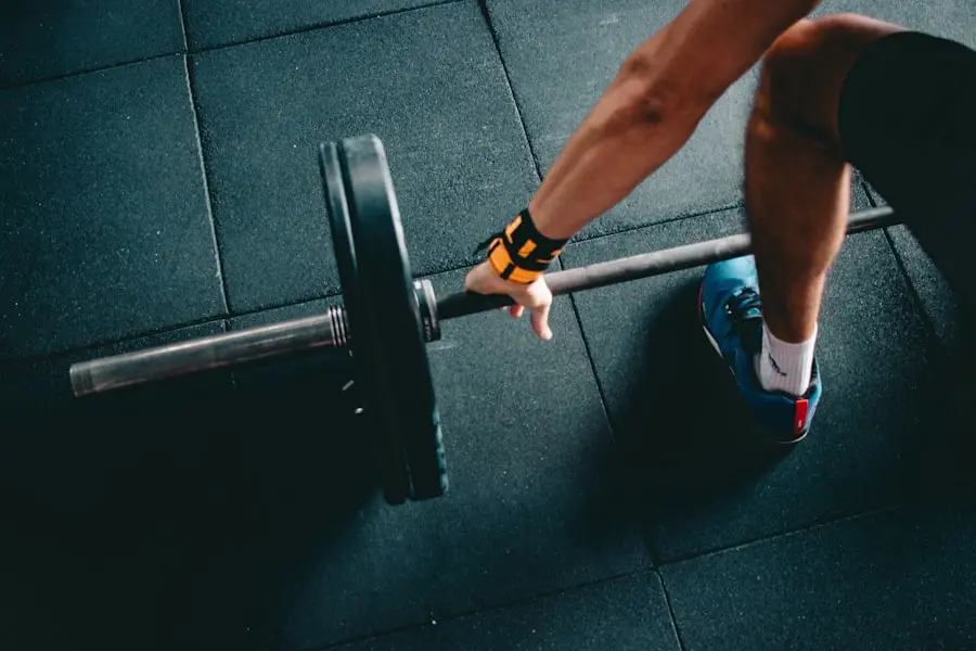 Hands on a barbell at floor level in the ARJFIT unit