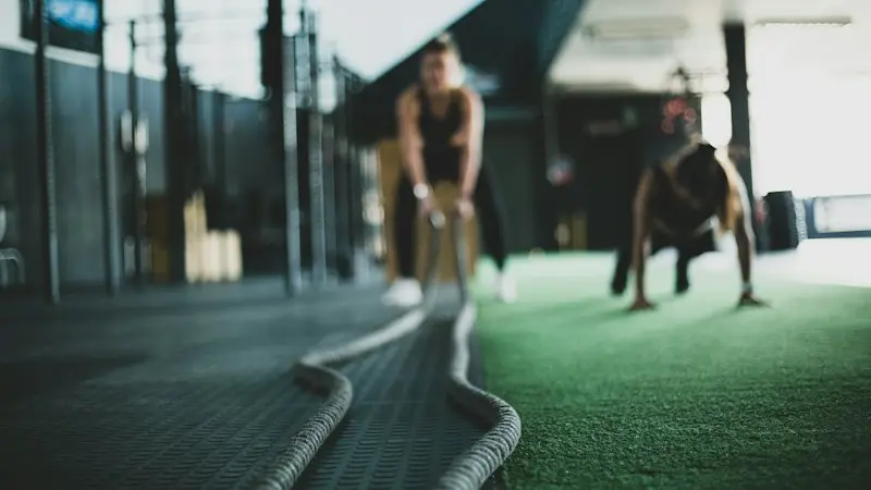 Battle-rope training session on turf