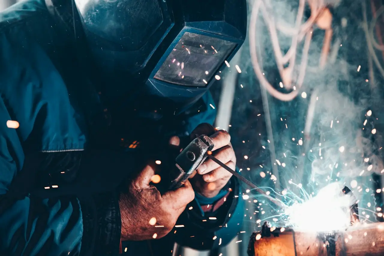 Welding a machine frame at the ARJFIT manufacturing unit